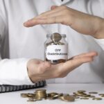 **Alt text:** Hands protecting a jar of coins labelled “CPF Contributions,” representing CPF contributions for employers in Singapore.